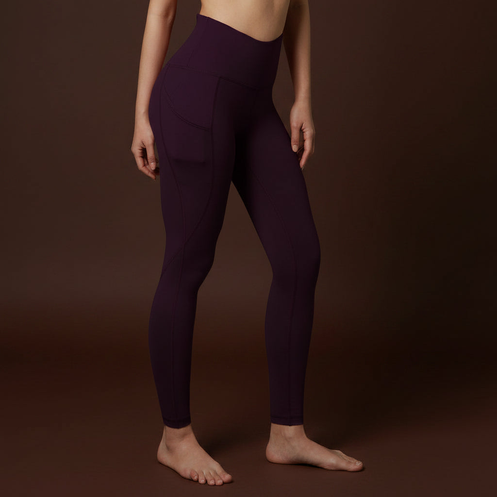 Purple high-waisted leggings worn on mode