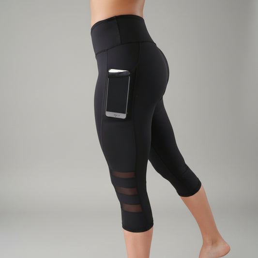 Black capri leggings with a phone in the side pocket