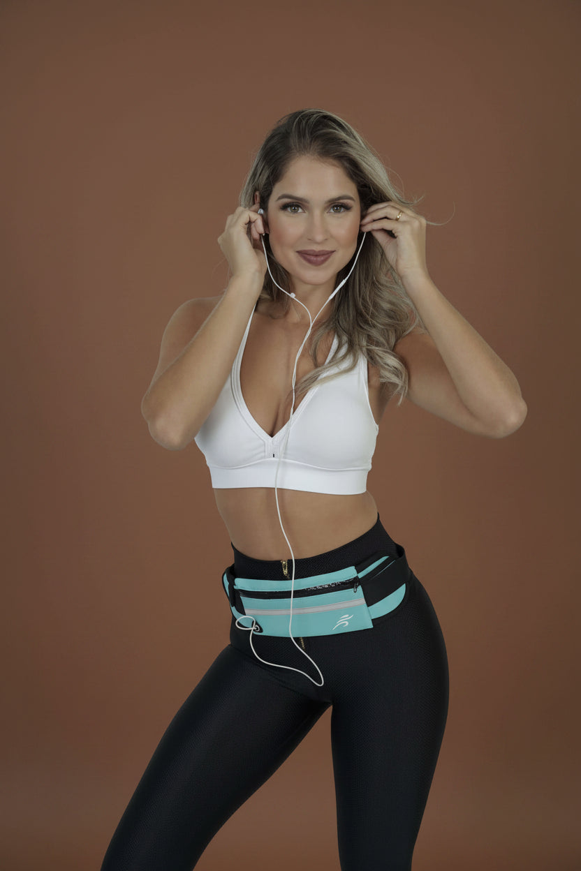 Woman wearing running belt around waist, close-up