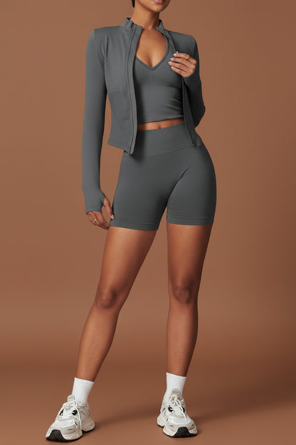 Grey-green cropped jacket, sports top and matching shorts