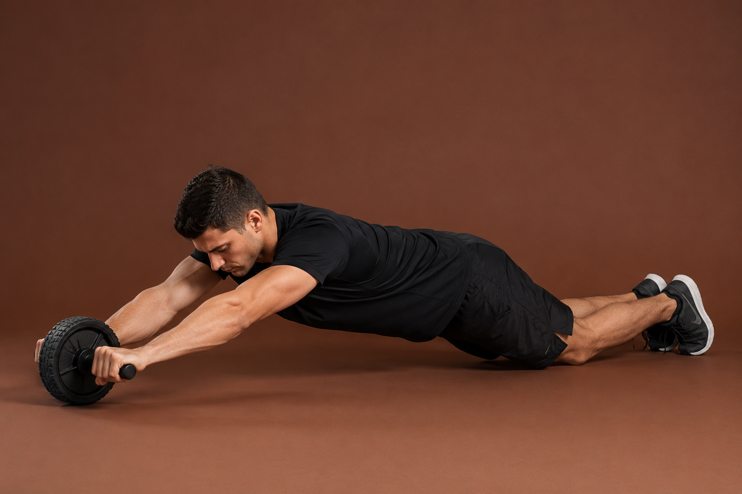 Person using double wheel ab roller for core workou