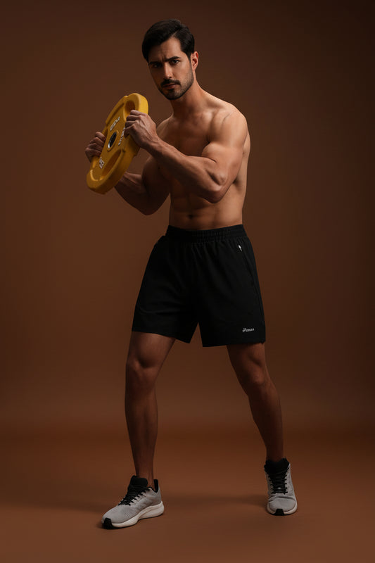 Man in athletic running shorts during outdoor workout session