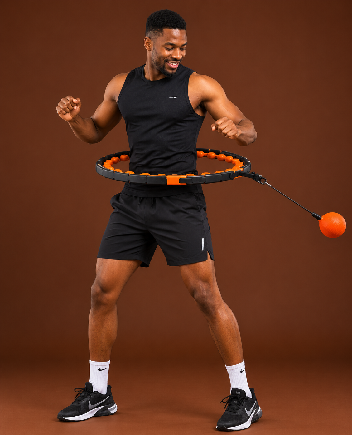Man spinning adjustable weighted hula hoop for fitness