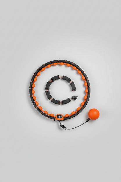 Segmented exercise hoop and attached orange weighted ball