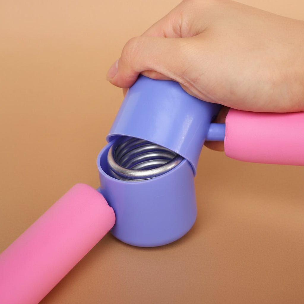close-up  of the durable steel spring hinge mechanism inside a blue plastic casing on a pink thigh exerciser