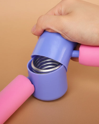 Close-up of the spring inside an exercise flexor hinge