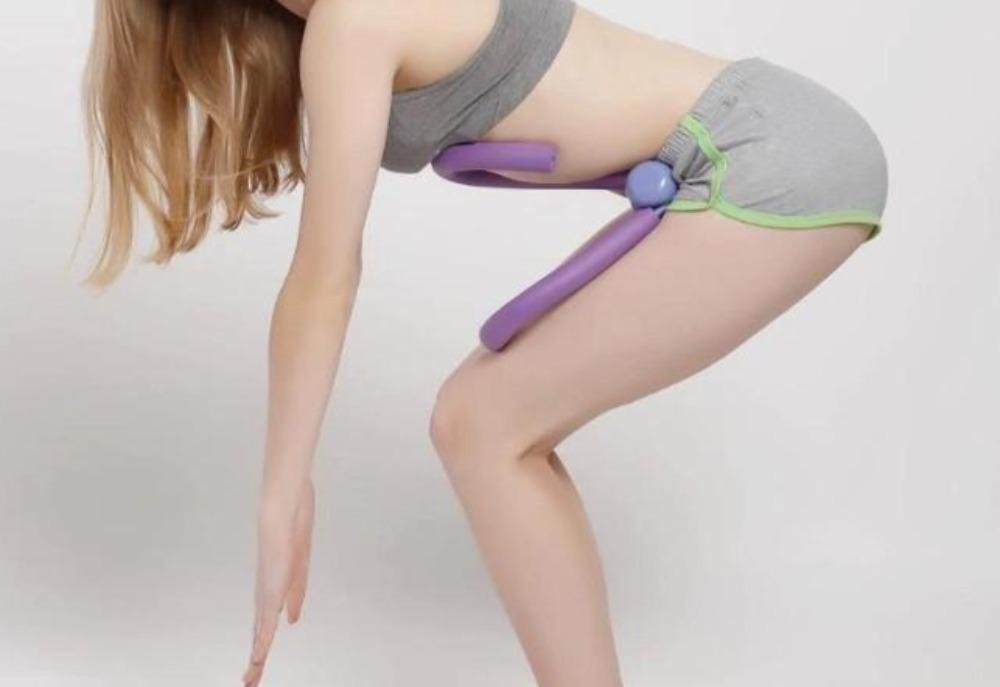 Glute and thigh workout using a purple pelvic floor muscle trainer