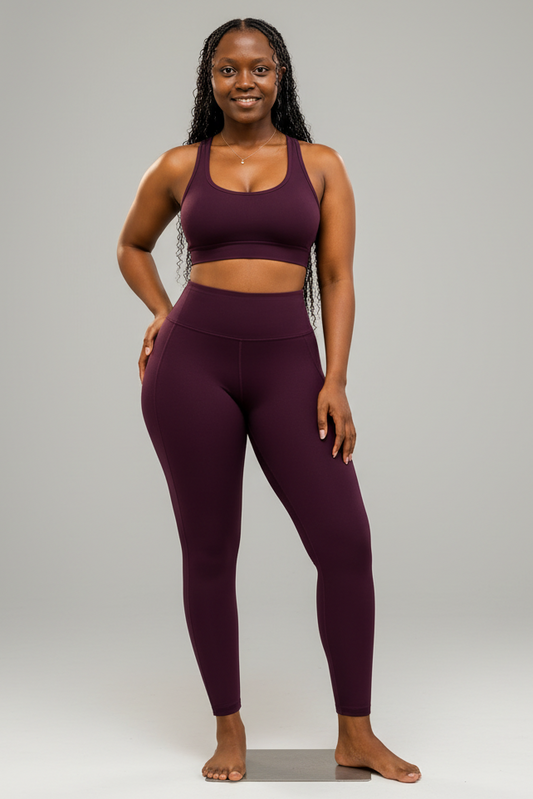 Woman wearing a burgundy crop top and matching leggings